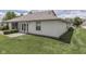 A charming backyard view shows off the well-maintained lawn and home exterior with a patio at 2025 Flamingo Way, Franklin, IN 46131
