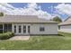 Backyard view shows the home's exterior with a patio and lawn at 2025 Flamingo Way, Franklin, IN 46131