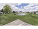 A serene backyard view includes the community pond with fountain at 2025 Flamingo Way, Franklin, IN 46131