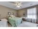 Bedroom with white furniture, a green bedspread, ceiling fan, and neutral walls at 2025 Flamingo Way, Franklin, IN 46131
