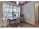 Bright breakfast nook features a small table set near a window with sheer, decorative curtains at 2025 Flamingo Way, Franklin, IN 46131