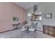 Elegant dining area with glass table, chandelier, and view of the kitchen at 2025 Flamingo Way, Franklin, IN 46131