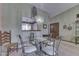 Elegant dining room with a glass table and decorative chandelier, perfect for entertaining at 2025 Flamingo Way, Franklin, IN 46131
