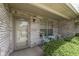 Inviting front porch with classic brick, decorative chairs, and ample natural light at 2025 Flamingo Way, Franklin, IN 46131