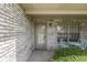 Inviting front porch with classic brick, decorative chairs, and ample natural light at 2025 Flamingo Way, Franklin, IN 46131