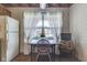Charming kitchen with a cozy dining nook and vintage decor, bathed in natural light at 2025 Flamingo Way, Franklin, IN 46131