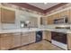 Kitchen featuring light wood cabinets, white countertops, and pass through to living area at 2025 Flamingo Way, Franklin, IN 46131