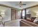 Cozy living room with laminate flooring, sliding closet doors, a ceiling fan, and comfortable seating at 2025 Flamingo Way, Franklin, IN 46131