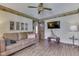 Open living area featuring laminate flooring, a brown sofa, and decoratively accessorized surfaces at 2025 Flamingo Way, Franklin, IN 46131
