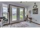 Bright sunroom with views of the backyard and lake, offering a peaceful retreat at 2025 Flamingo Way, Franklin, IN 46131