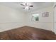 Clean, minimalist bedroom featuring hardwood floors, one window, and white walls at 2027 Round Barn Ct, Anderson, IN 46017
