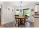 Breakfast nook with wood table and seating, adjacent to the kitchen at 2027 Round Barn Ct, Anderson, IN 46017