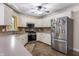 Bright kitchen featuring white cabinetry, stainless steel appliances, and tile backsplash at 2027 Round Barn Ct, Anderson, IN 46017