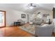 Bright living room with hardwood floors, area rug, and backyard access at 2027 Round Barn Ct, Anderson, IN 46017