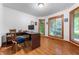 Bright home office space with hardwood floors and a corner desk at 2027 Round Barn Ct, Anderson, IN 46017
