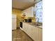 Functional kitchen featuring essential appliances, wood-style floors and ample counter space at 208 E Madison E St, Alexandria, IN 46001