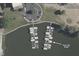 Aerial view of a community boat dock featuring multiple covered boat slips for easy and protected water access at 20971 Shoreline Ct # 201, Noblesville, IN 46062