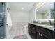 Bathroom featuring a double vanity, granite countertops, modern fixtures, and a separate toilet area at 20971 Shoreline Ct # 201, Noblesville, IN 46062