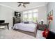 Bedroom featuring a large window, comfortable furnishings, and ample natural light at 20971 Shoreline Ct # 201, Noblesville, IN 46062