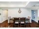 Neutral-toned dining area with hardwood floors, table with four chairs, and wall decor at 20971 Shoreline Ct # 201, Noblesville, IN 46062