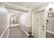 Condo hallway view showing clean well-lit neutral colored hallways at 20971 Shoreline Ct # 201, Noblesville, IN 46062