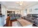 Open-concept layout featuring a living room with comfortable sofas that seamlessly flow into the modern kitchen at 20971 Shoreline Ct # 201, Noblesville, IN 46062