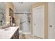 Bathroom featuring a walk-in shower, vanity with a marble countertop, and ample lighting at 2163 Bradford Trace Blvd, Indianapolis, IN 46229