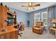 Comfortable bedroom featuring a ceiling fan, desk and chair, and a relaxing recliner at 2163 Bradford Trace Blvd, Indianapolis, IN 46229