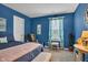 Bright bedroom features large window, cozy bed with bench seating, and natural light at 2163 Bradford Trace Blvd, Indianapolis, IN 46229