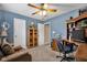 Spacious bedroom with a desk, hutch, and comfortable seating area at 2163 Bradford Trace Blvd, Indianapolis, IN 46229