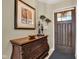 Warm foyer featuring elegant decor, dark wood door and decorative accents at 2163 Bradford Trace Blvd, Indianapolis, IN 46229