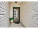 Cozy covered front porch with decorative glass door and charming decor at 2163 Bradford Trace Blvd, Indianapolis, IN 46229