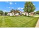 Spacious front yard with well-maintained lawn and mature trees at 2163 Bradford Trace Blvd, Indianapolis, IN 46229
