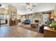 Comfortable living room with hardwood floors, fireplace, and ample natural light at 2163 Bradford Trace Blvd, Indianapolis, IN 46229
