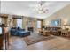 Well-lit living room featuring a vaulted ceiling and comfortable seating at 2163 Bradford Trace Blvd, Indianapolis, IN 46229