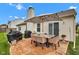 Outdoor patio featuring dining set, covered grills, and a view of the backyard at 2163 Bradford Trace Blvd, Indianapolis, IN 46229