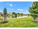 Scenic view of a tranquil pond surrounded by lush greenery in a well-maintained community at 2163 Bradford Trace Blvd, Indianapolis, IN 46229
