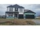New two-story home featuring a black roof, white siding and black trim, plus an attached two car garage at 2271 Oakmont Dr, Plainfield, IN 46168