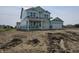 Two-story home under construction, showcasing the framing and initial exterior, along with an attached two-car garage at 2271 Oakmont Dr, Plainfield, IN 46168
