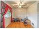 Bedroom with hardwood floors and a view of the outdoors through a window at 2445 S Bolton Ave, Indianapolis, IN 46203