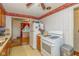 Practical kitchen featuring an oven, refrigerator, and view into another room at 2445 S Bolton Ave, Indianapolis, IN 46203