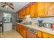 Functional kitchen with wood cabinetry, Formica countertops, and essential appliances at 2445 S Bolton Ave, Indianapolis, IN 46203