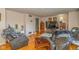 Cozy living room features hardwood floors, comfortable seating, and ample natural light at 2445 S Bolton Ave, Indianapolis, IN 46203