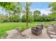 Serene backyard featuring a lush lawn, comfortable outdoor seating, and picturesque landscaping at 246 Westchester Blvd, Noblesville, IN 46062