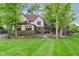 Expansive backyard with a well-manicured lawn, a charming patio, and a lovely two-story home at 246 Westchester Blvd, Noblesville, IN 46062