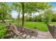 Beautiful backyard with a lush lawn, stone pathway, and serene landscaping perfect for outdoor enjoyment at 246 Westchester Blvd, Noblesville, IN 46062