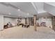 Open basement featuring neutral carpeting, wooden columns, and plenty of room for activities at 246 Westchester Blvd, Noblesville, IN 46062
