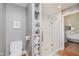 Bathroom featuring modern shower, storage, and commode at 246 Westchester Blvd, Noblesville, IN 46062
