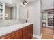 Bathroom features a double vanity with brown wood cabinets, and modern fixtures at 246 Westchester Blvd, Noblesville, IN 46062