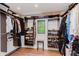 Walk-in closet features wood floors, custom organizers, and a window for natural light at 246 Westchester Blvd, Noblesville, IN 46062